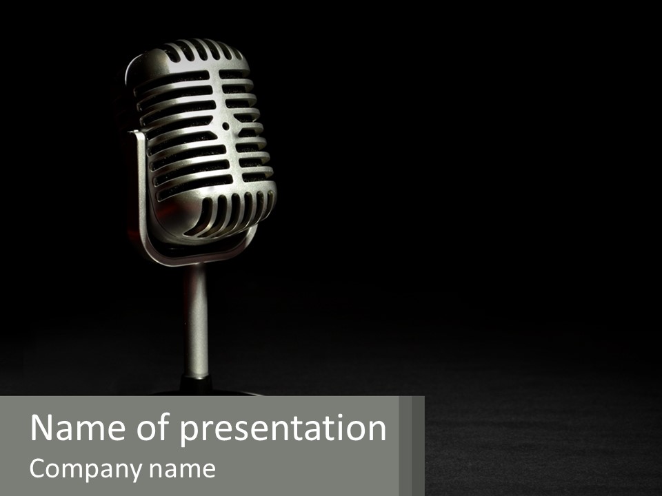 A Microphone On A Stand With A Black Background PowerPoint Template