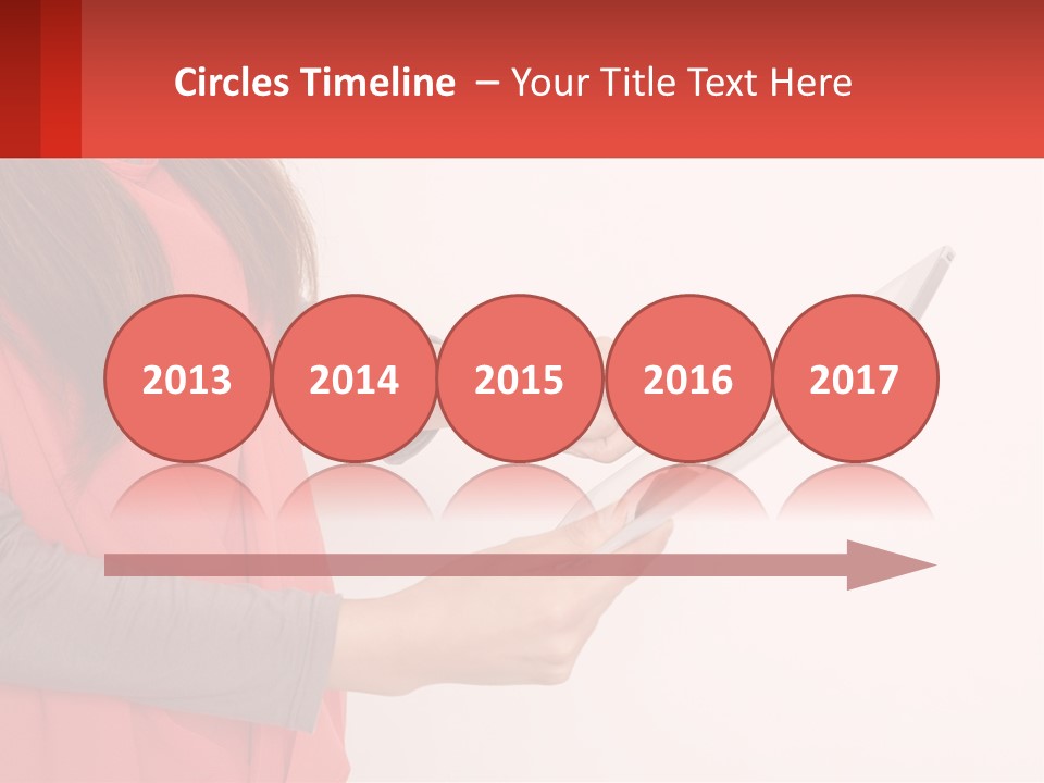 A Woman Holding A Tablet Computer In Her Hands PowerPoint Template