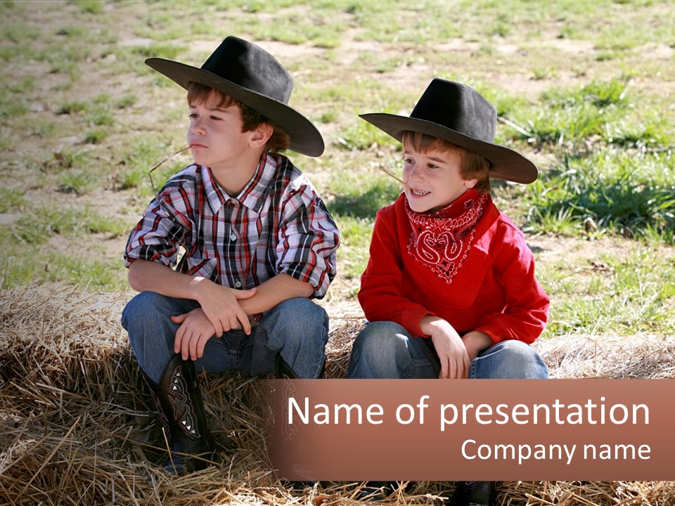 Two Children In Cowboy Hats Sitting On A Pile Of Hay PowerPoint Template