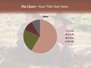 Two Children In Cowboy Hats Sitting On A Pile Of Hay PowerPoint Template