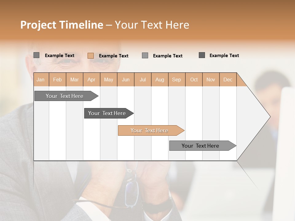 A Man In A Business Suit Sitting In Front Of A Laptop PowerPoint Template