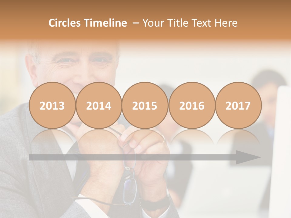 A Man In A Business Suit Sitting In Front Of A Laptop PowerPoint Template