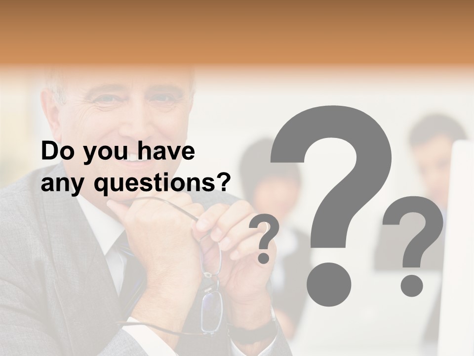 A Man In A Business Suit Sitting In Front Of A Laptop PowerPoint Template