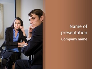 A Man And A Woman Sitting At A Table Talking To Each Other PowerPoint Template