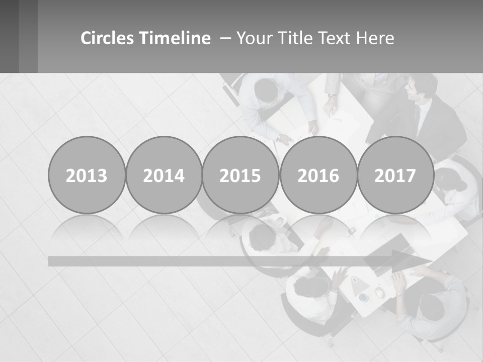 A Group Of People Sitting Around A Table PowerPoint Template