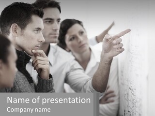 A Group Of People Looking At A Whiteboard PowerPoint Template