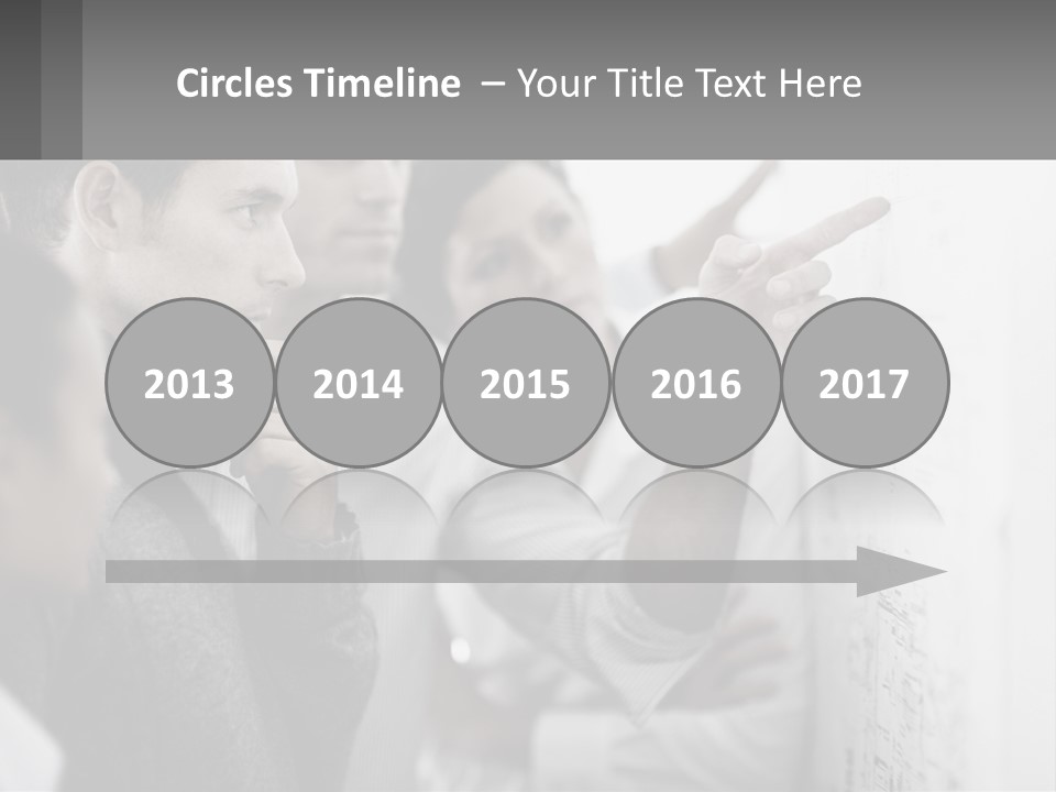 A Group Of People Looking At A Whiteboard PowerPoint Template