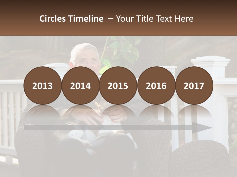 A Man Sitting On A Chair Holding A Dog PowerPoint Template