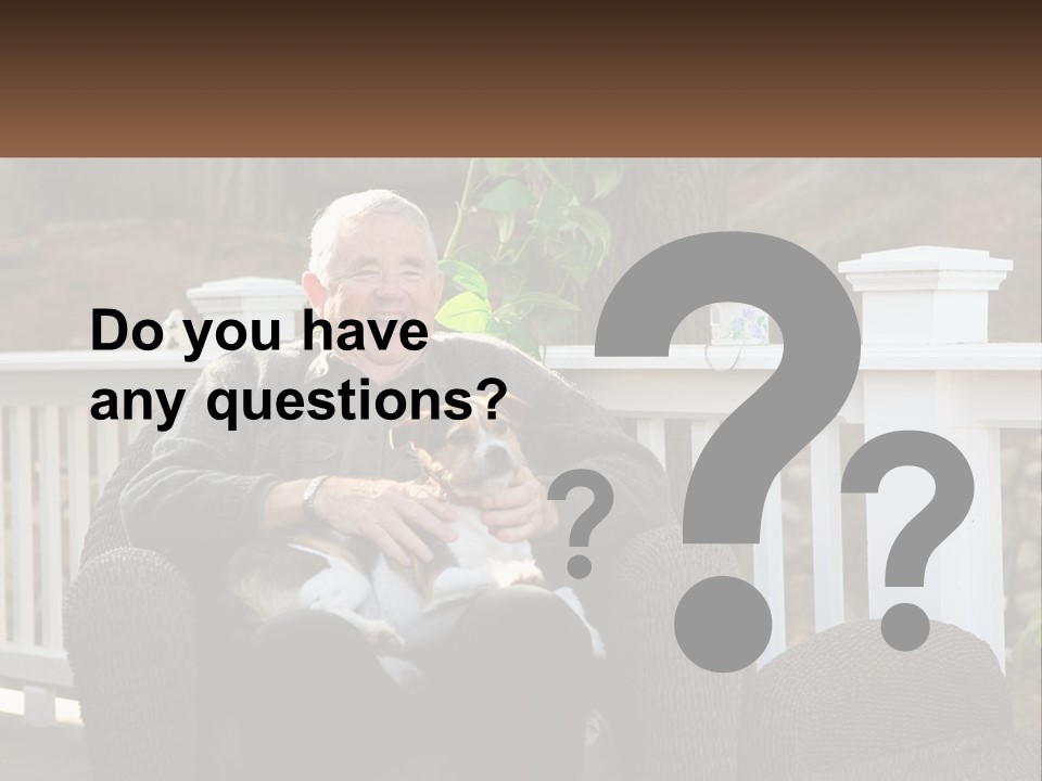 A Man Sitting On A Chair Holding A Dog PowerPoint Template