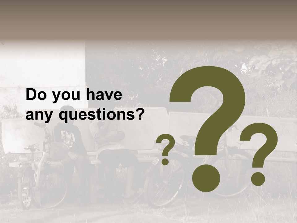 Two Boys Sitting On A Bench In A Park PowerPoint Template