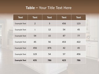 A Large Kitchen With White Cabinets And A Center Island PowerPoint Template