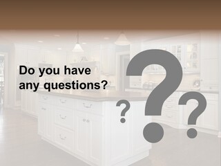 A Large Kitchen With White Cabinets And A Center Island PowerPoint Template