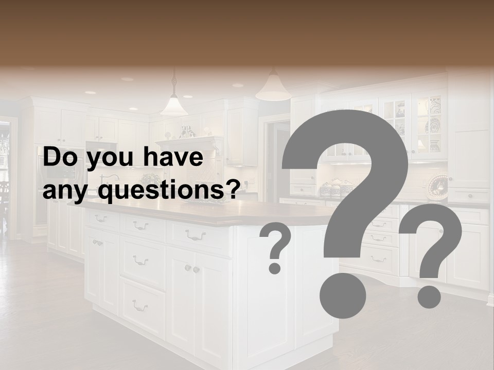 A Large Kitchen With White Cabinets And A Center Island PowerPoint Template