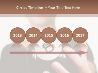 A Woman Holding A Black Ball With A White Letter B On It PowerPoint Template