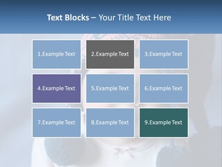 A Baby Wearing A Hat With Pom Poms PowerPoint Template