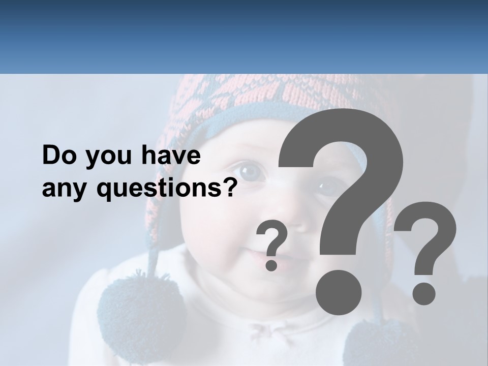 A Baby Wearing A Hat With Pom Poms PowerPoint Template