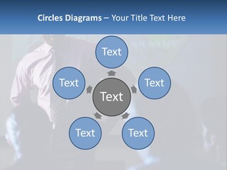 A Man In A Pink Shirt And Tie Standing In Front Of A Projector Screen PowerPoint Template