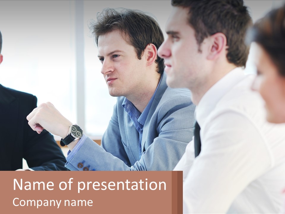 A Group Of People Sitting At A Table In A Meeting PowerPoint Template