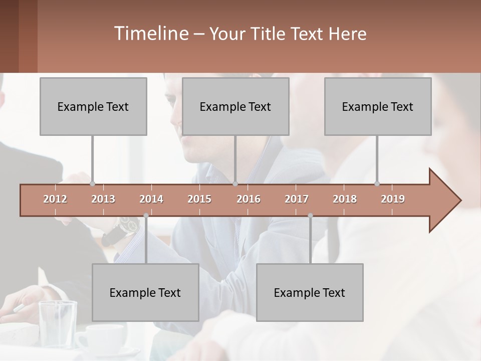 A Group Of People Sitting At A Table In A Meeting PowerPoint Template