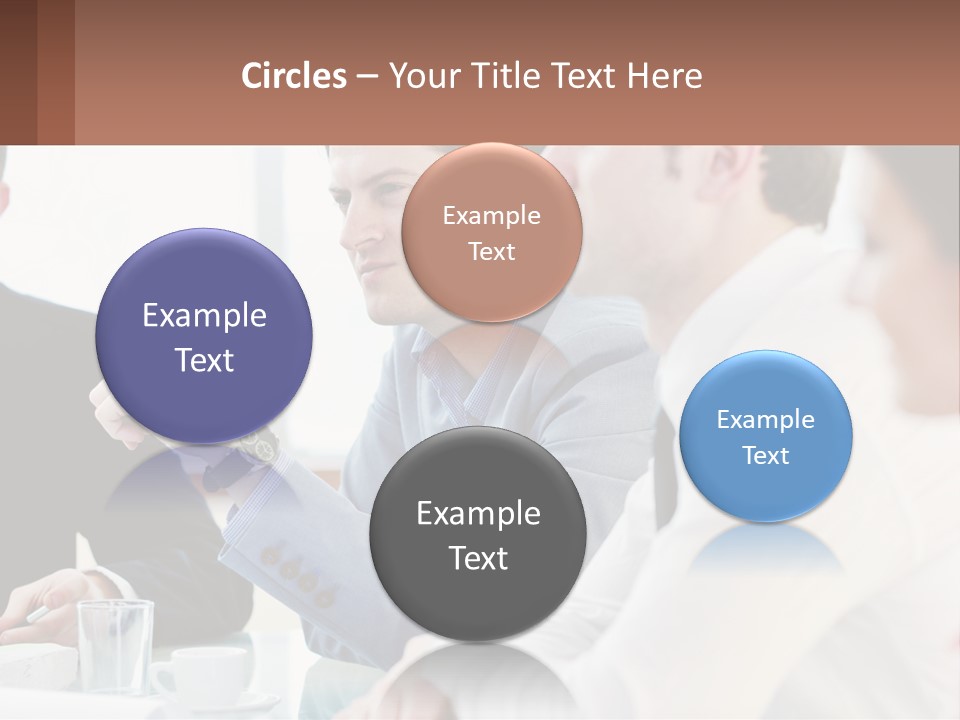 A Group Of People Sitting At A Table In A Meeting PowerPoint Template