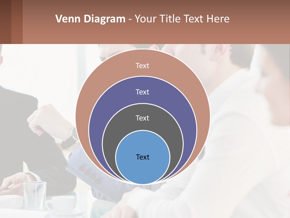 A Group Of People Sitting At A Table In A Meeting PowerPoint Template