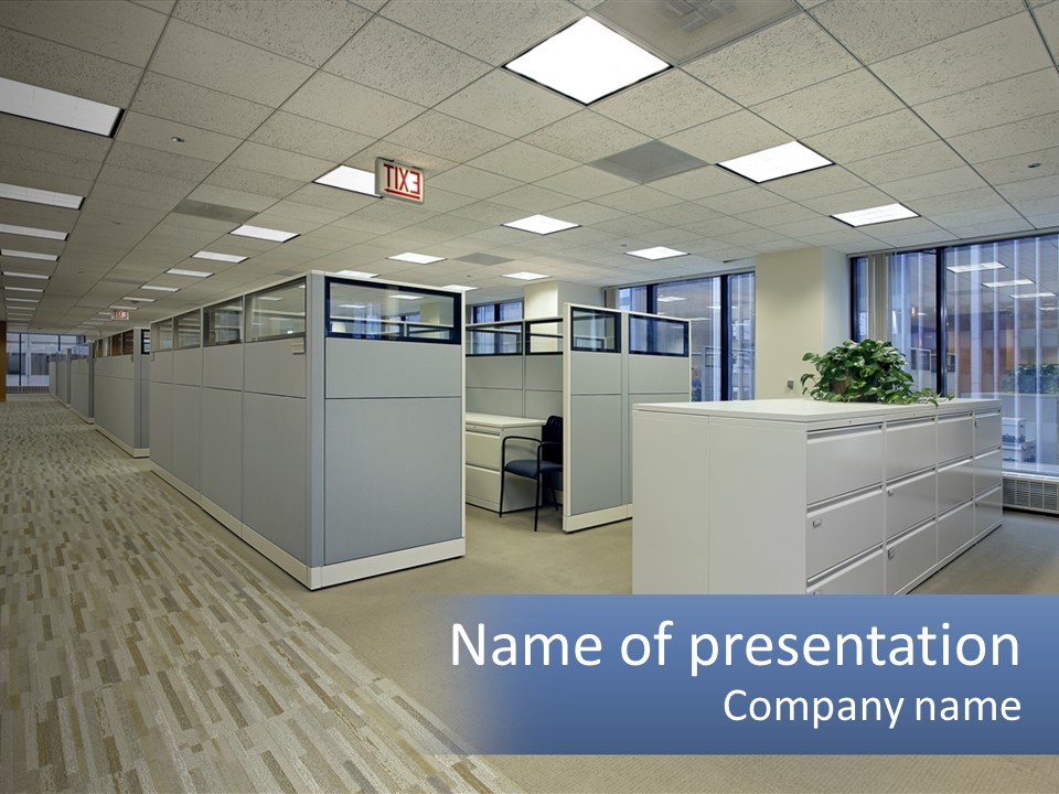 An Empty Office With A Desk And Filing Cabinets PowerPoint Template