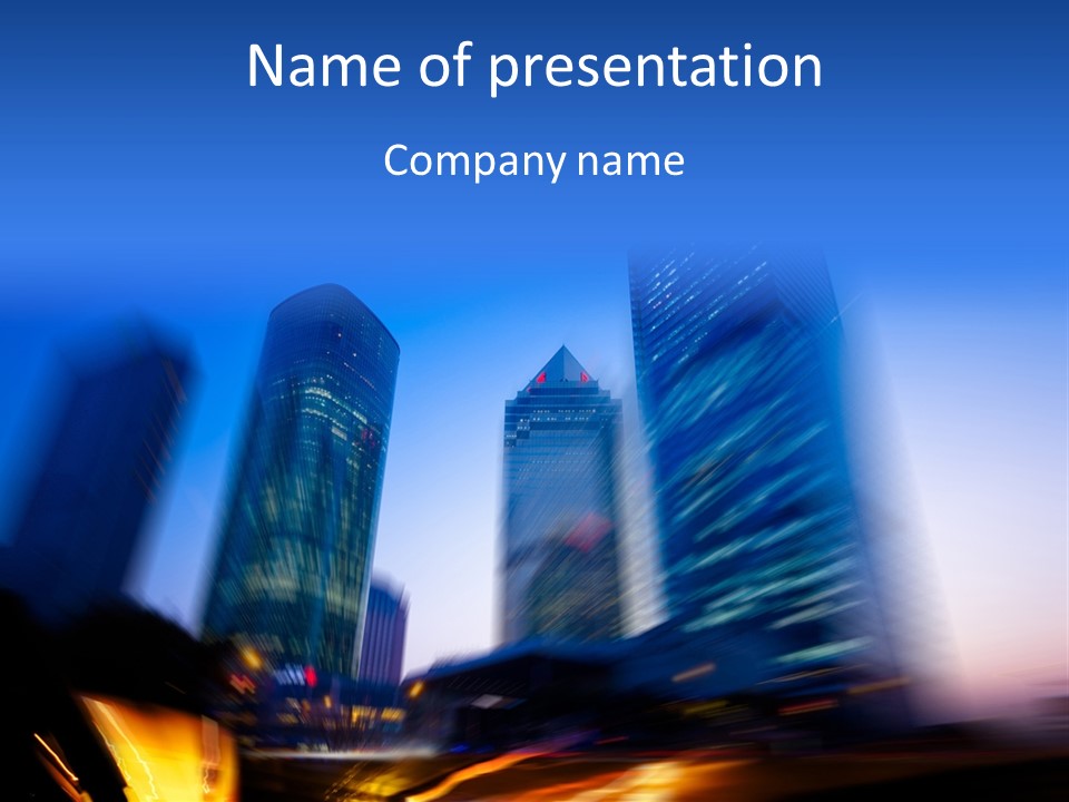 A Blurry Image Of A City At Night PowerPoint Template
