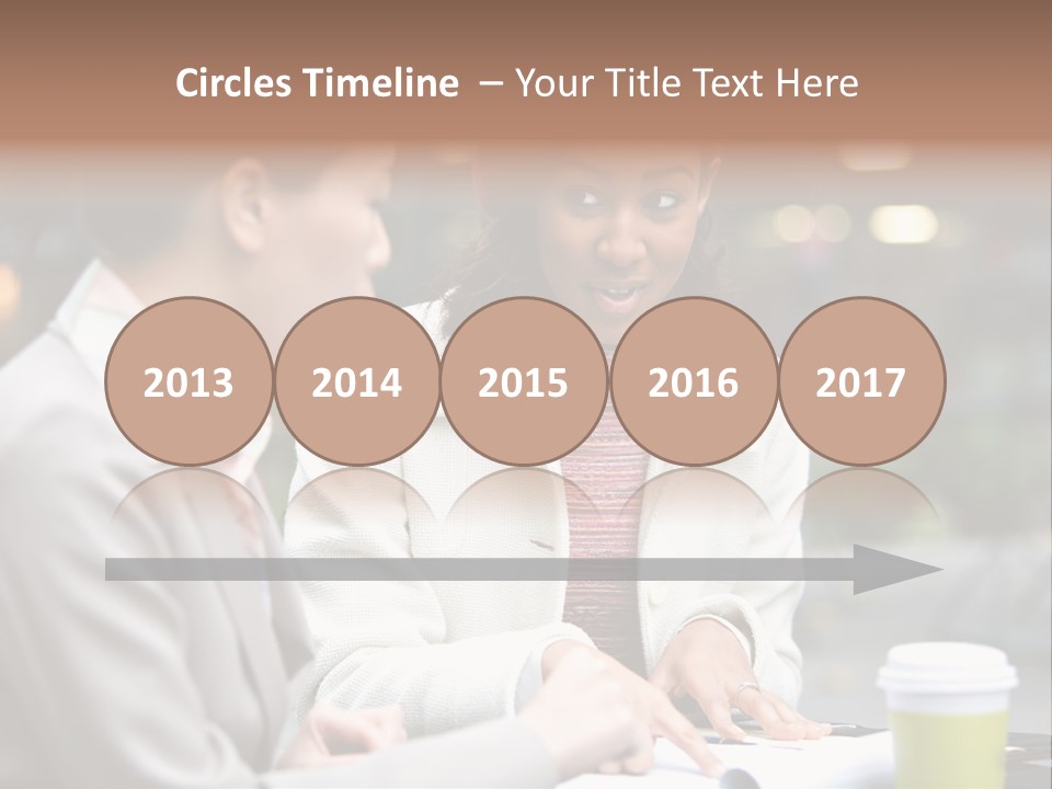 Two Women Sitting At A Table Talking To Each Other PowerPoint Template