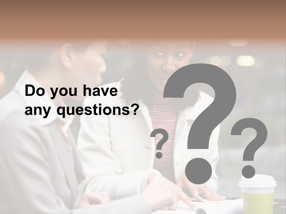 Two Women Sitting At A Table Talking To Each Other PowerPoint Template