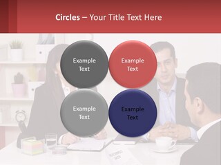 A Group Of People Sitting Around A Table Talking PowerPoint Template