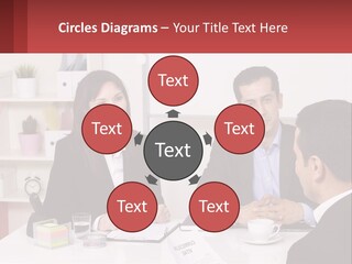A Group Of People Sitting Around A Table Talking PowerPoint Template