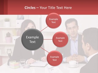 A Group Of People Sitting Around A Table Talking PowerPoint Template