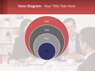 A Group Of People Sitting Around A Table Talking PowerPoint Template