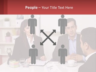 A Group Of People Sitting Around A Table Talking PowerPoint Template