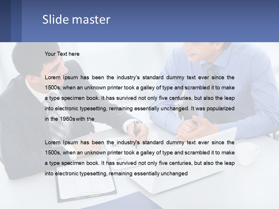 Two Men Sitting At A Table In Front Of A Laptop PowerPoint Template