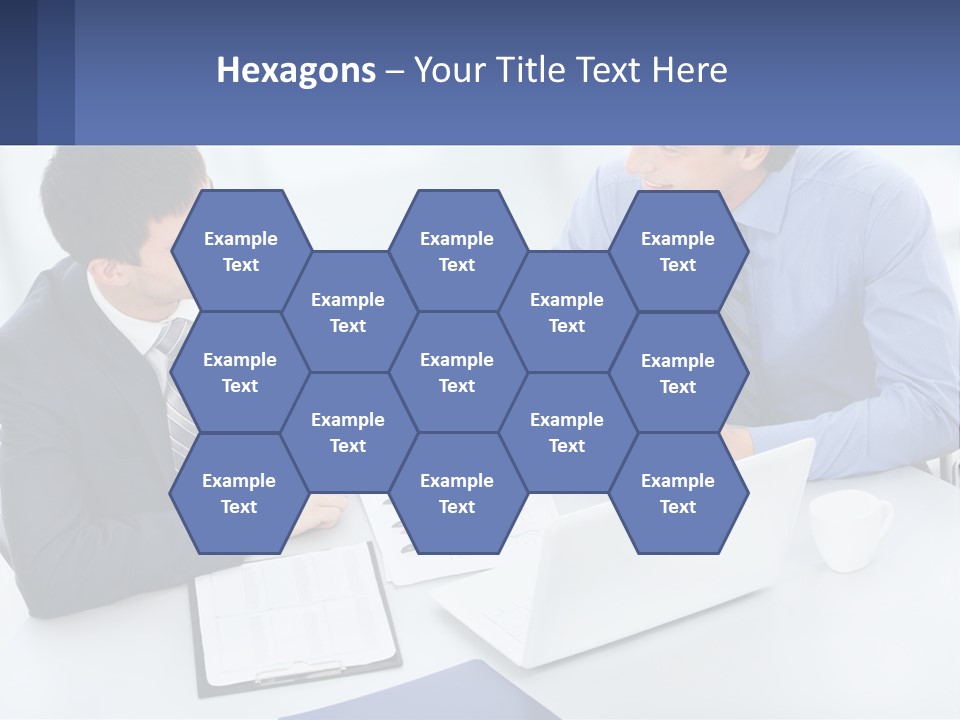 Two Men Sitting At A Table In Front Of A Laptop PowerPoint Template