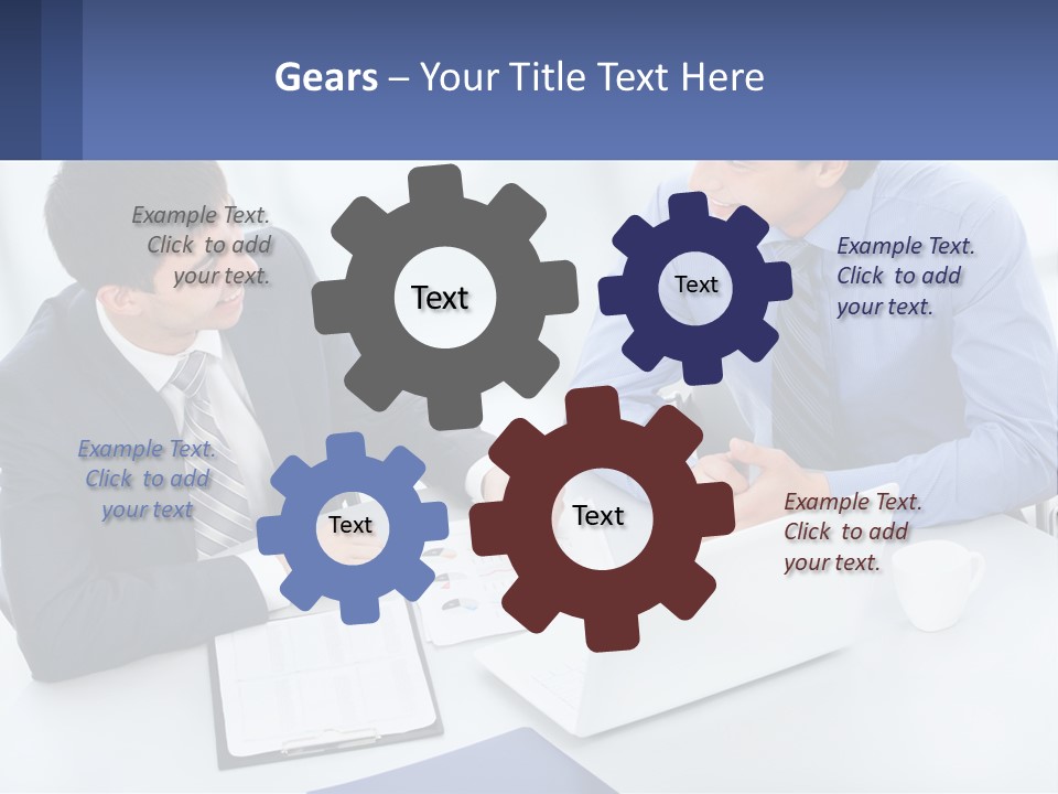 Two Men Sitting At A Table In Front Of A Laptop PowerPoint Template