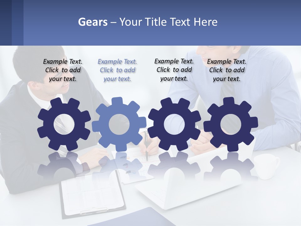 Two Men Sitting At A Table In Front Of A Laptop PowerPoint Template