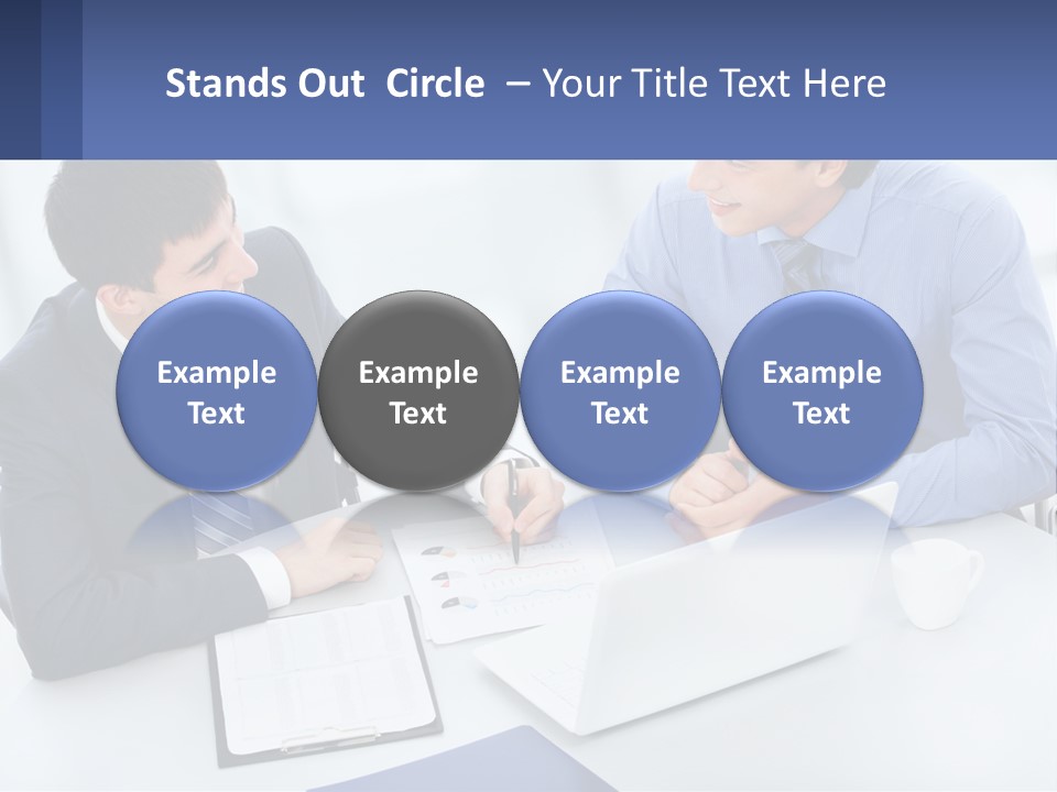 Two Men Sitting At A Table In Front Of A Laptop PowerPoint Template