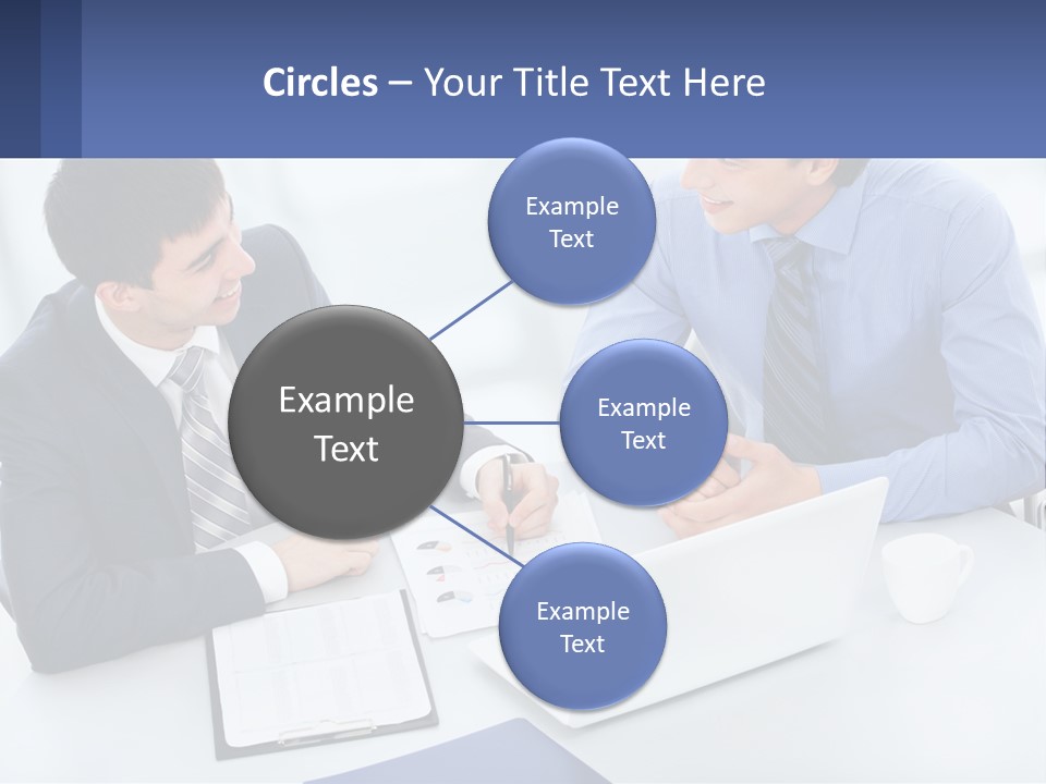 Two Men Sitting At A Table In Front Of A Laptop PowerPoint Template