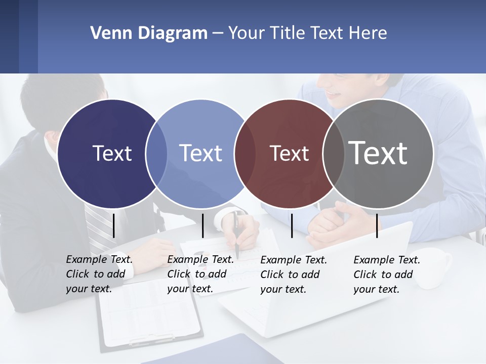 Two Men Sitting At A Table In Front Of A Laptop PowerPoint Template