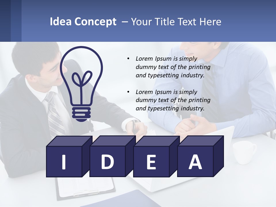 Two Men Sitting At A Table In Front Of A Laptop PowerPoint Template