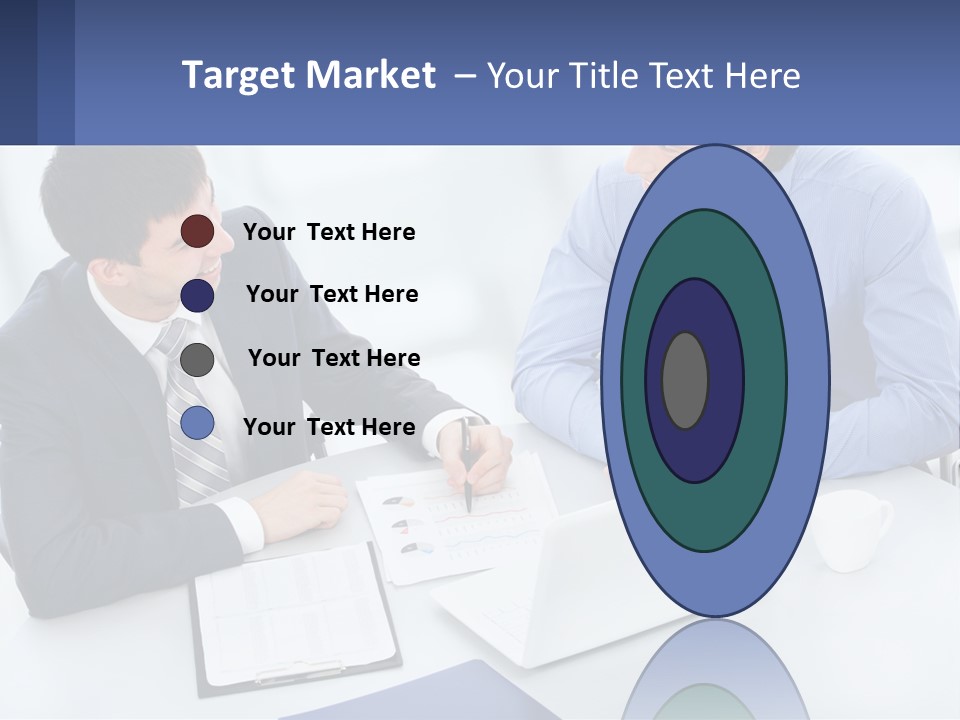 Two Men Sitting At A Table In Front Of A Laptop PowerPoint Template