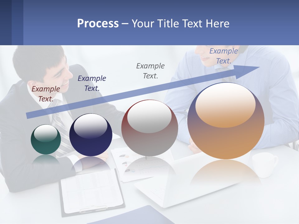 Two Men Sitting At A Table In Front Of A Laptop PowerPoint Template