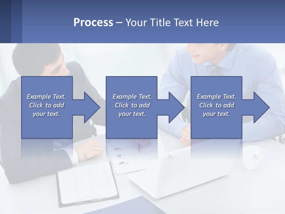 Two Men Sitting At A Table In Front Of A Laptop PowerPoint Template