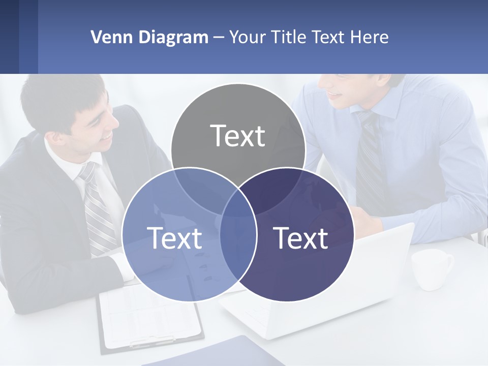 Two Men Sitting At A Table In Front Of A Laptop PowerPoint Template