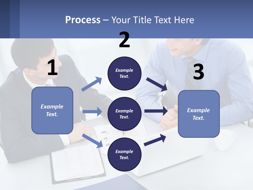 Two Men Sitting At A Table In Front Of A Laptop PowerPoint Template