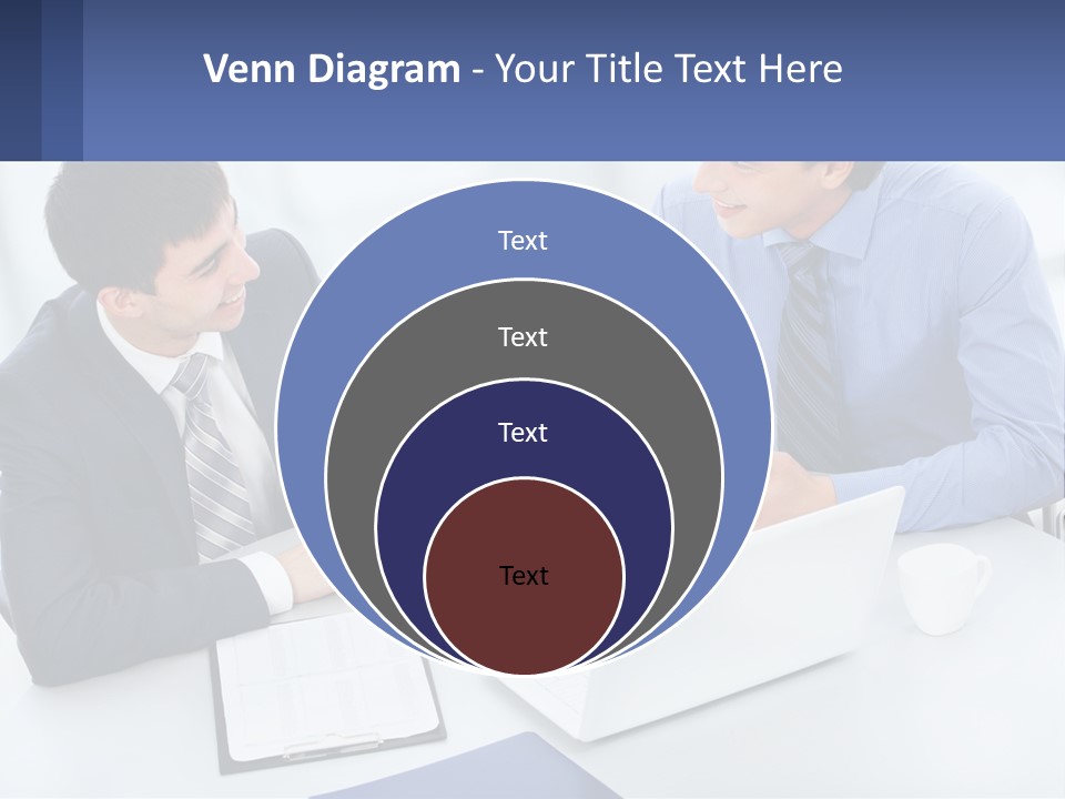 Two Men Sitting At A Table In Front Of A Laptop PowerPoint Template