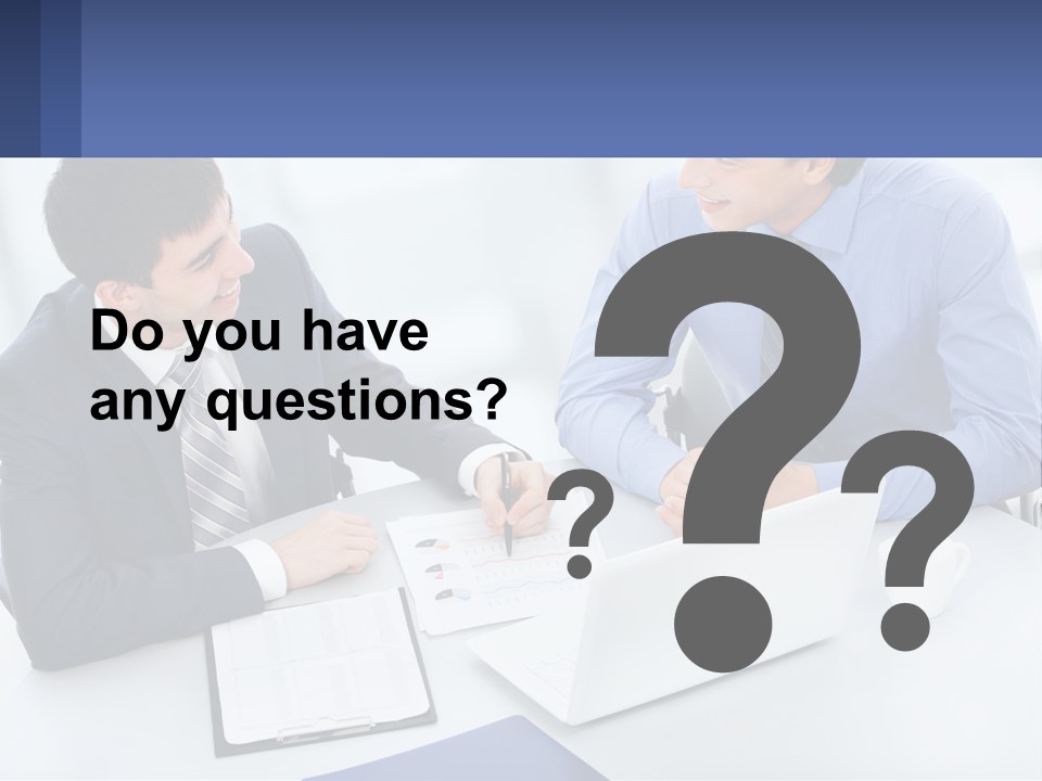 Two Men Sitting At A Table In Front Of A Laptop PowerPoint Template