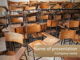 A Classroom Filled With Lots Of Wooden Chairs PowerPoint Template